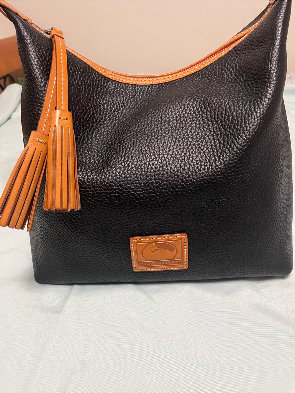 Dooney & Bourke Black Pebble Leather Hobo with Tan Trim and Tassel
